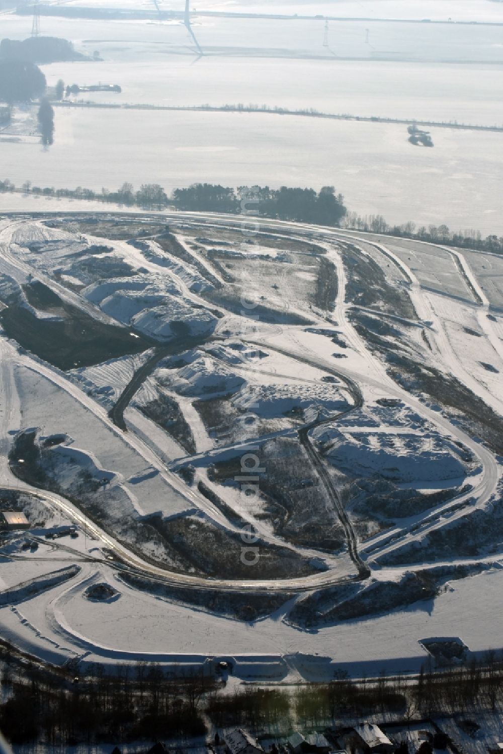  from above - Winterly snowy view of the dump Schwanebeck in the state Brandenburg