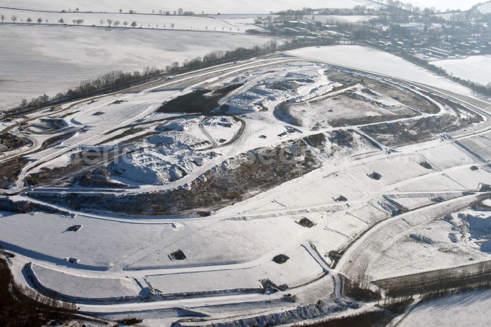  from the bird's eye view: Winterly snowy view of the dump Schwanebeck in the state Brandenburg