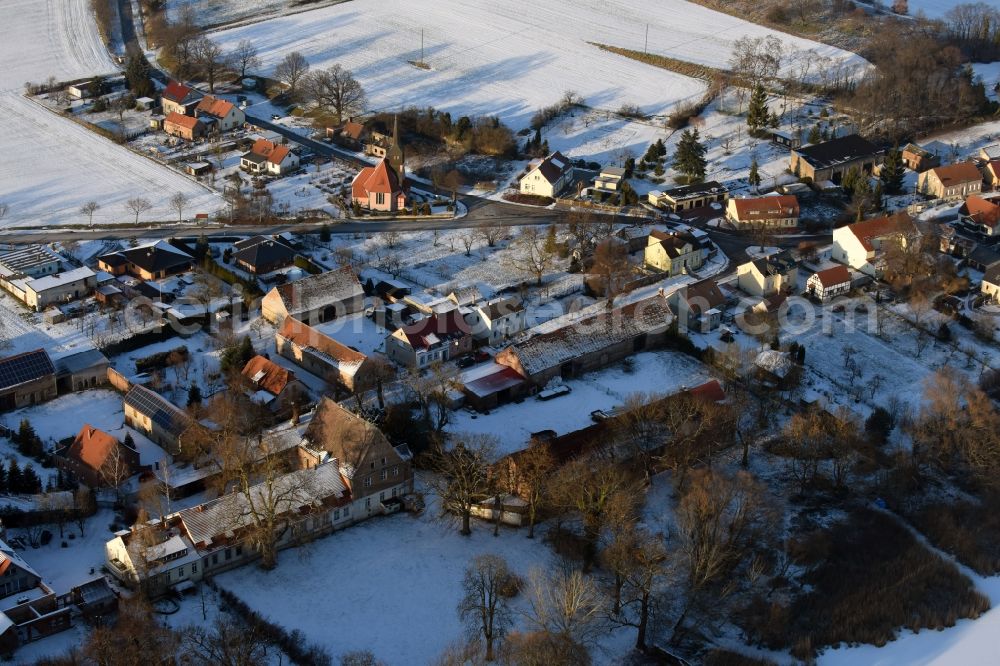 Päwesin from the bird's eye view: Wintry snowy village view in Bagow in the state Brandenburg