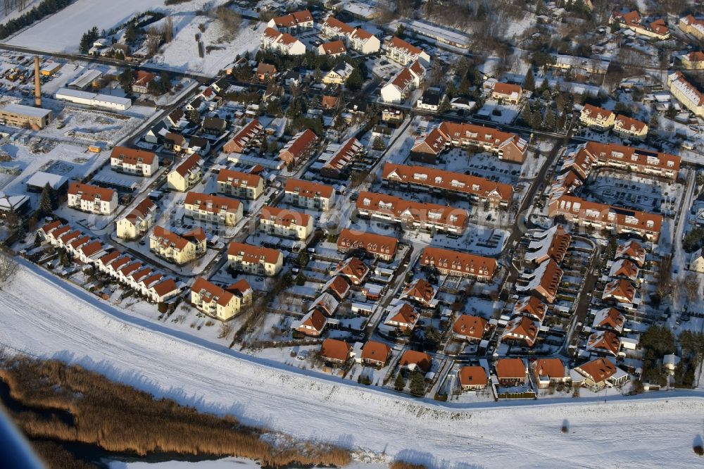 Gerwisch from the bird's eye view: Wintry snowy village view in Gerwisch in the state Saxony-Anhalt