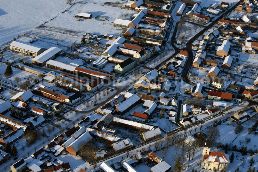 Karow from the bird's eye view: Wintry snowy village view in Karow in the state Saxony-Anhalt