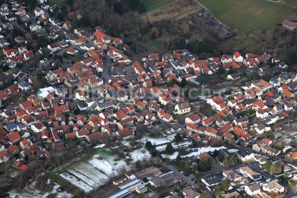 Wackernheim from the bird's eye view: Wintry snowy village view in Wackernheim in the state Rhineland-Palatinate