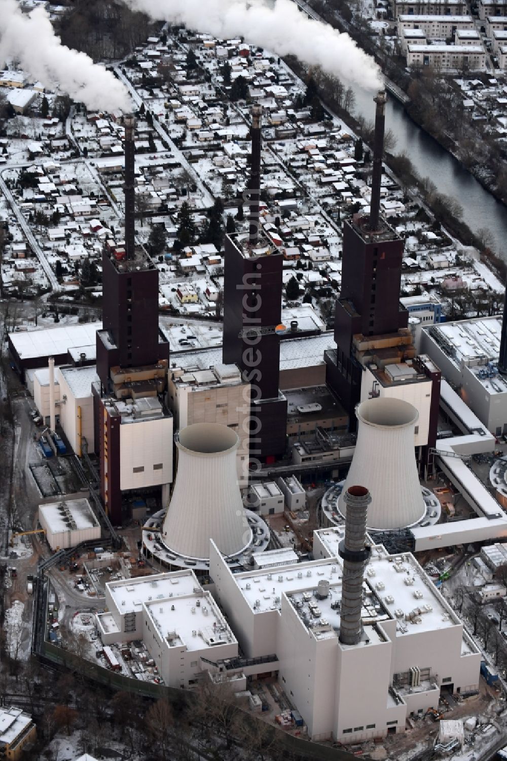 Berlin from above - Wintry snowy exhaust towers of the Vattenfall Europe AG at the canal eltowkanal in Berlin Lichterfelde