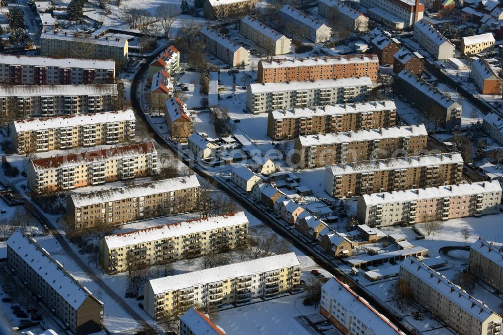 Burg from above - Wintry snow-covered buildings of the residential area on Wilhelm-Kuhr-Strasse in Burg in the state of Saxony-Anhalt