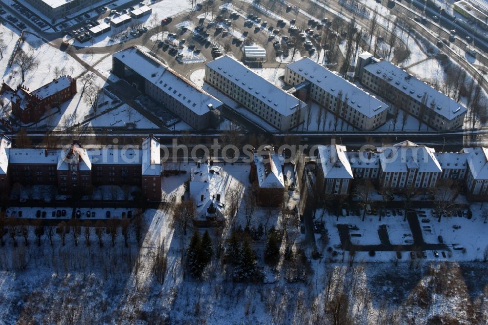 Brandenburg an der Havel from above - Wintry snow-covered and historic buildings on Magdeburger Strasse in Brandenburg an der Havel in the state of Brandenburg. View from the North. The state school office and the county court are located in the South of the street. North of it are buildings of the former Cuirassier military buildings with residential and business areas