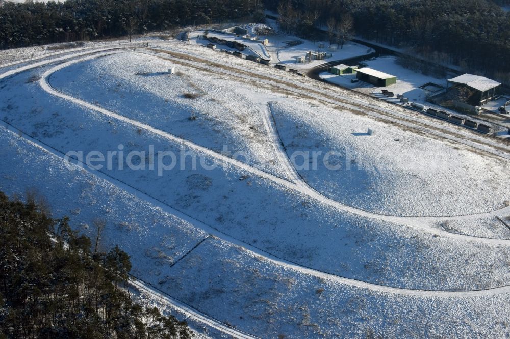 Elbe-Parey from above - Wintry snow-covered site of the heaped landfill Werderberg in Elbe-Parey in the state of Saxony-Anhalt. The landfill is part of Abfallwirtschaftsgesellschaft Jerichower Land mbH (the county waste management company) and is located between Elbe-Parey and the village of Bergzow