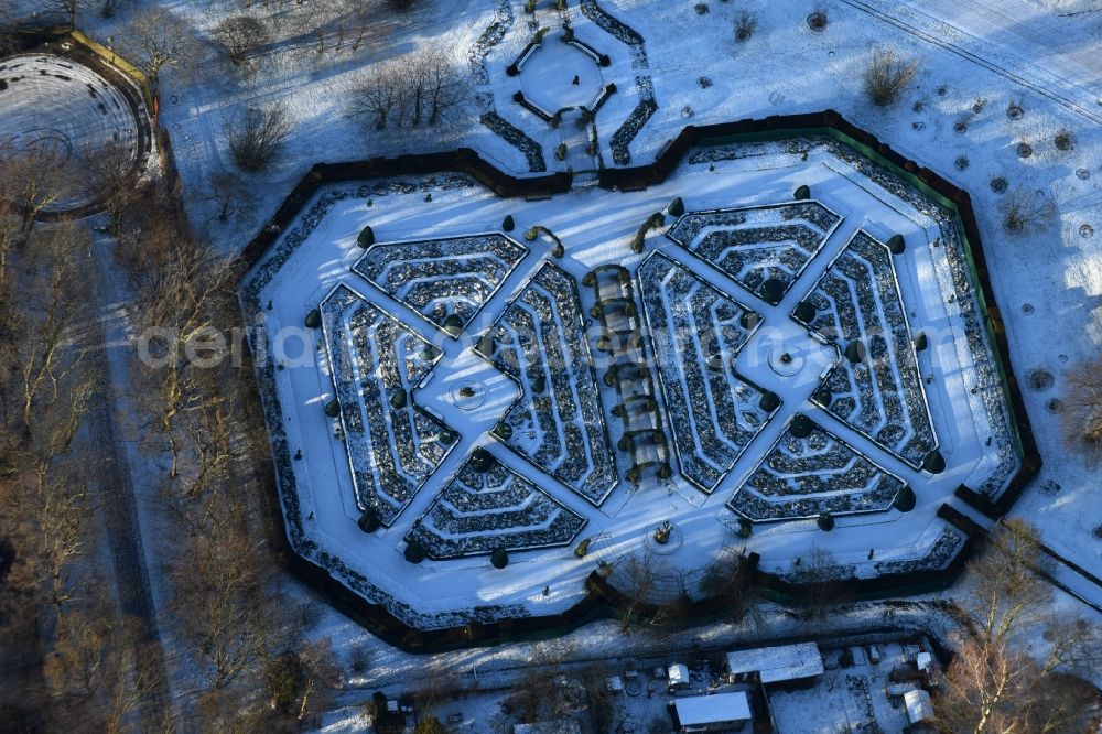 Berlin from above - Wintery snow-covered labyrinth maze park in the Britzergarten recreational park in Berlin