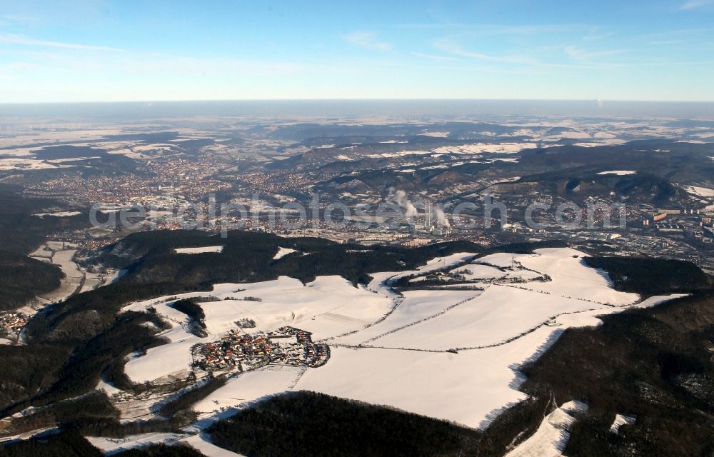 Bucha from above - Wintry view of the snow-covered village of Ossmaritz in the state of Thuringia. Ossmaritz is located above the Jagdberg Tunnel of the federal motorway A4. The background shows the town of Jena