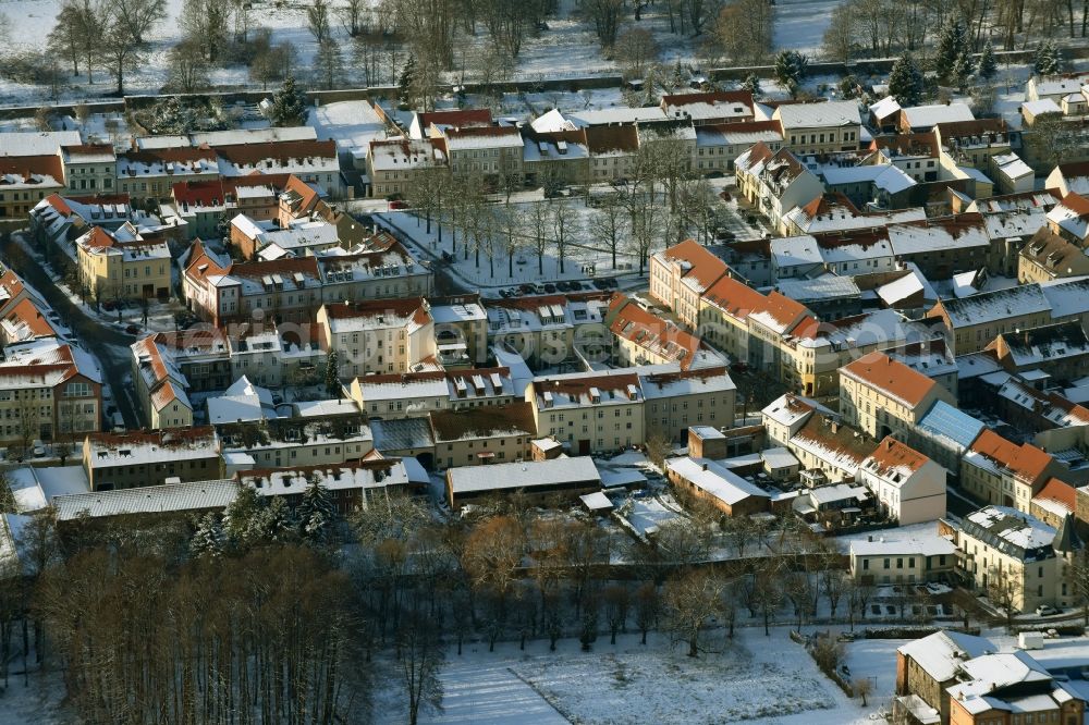 Altlandsberg from above - Wintry snowy townscape with streets and houses of the residential areas in Altlandsberg in the state Brandenburg