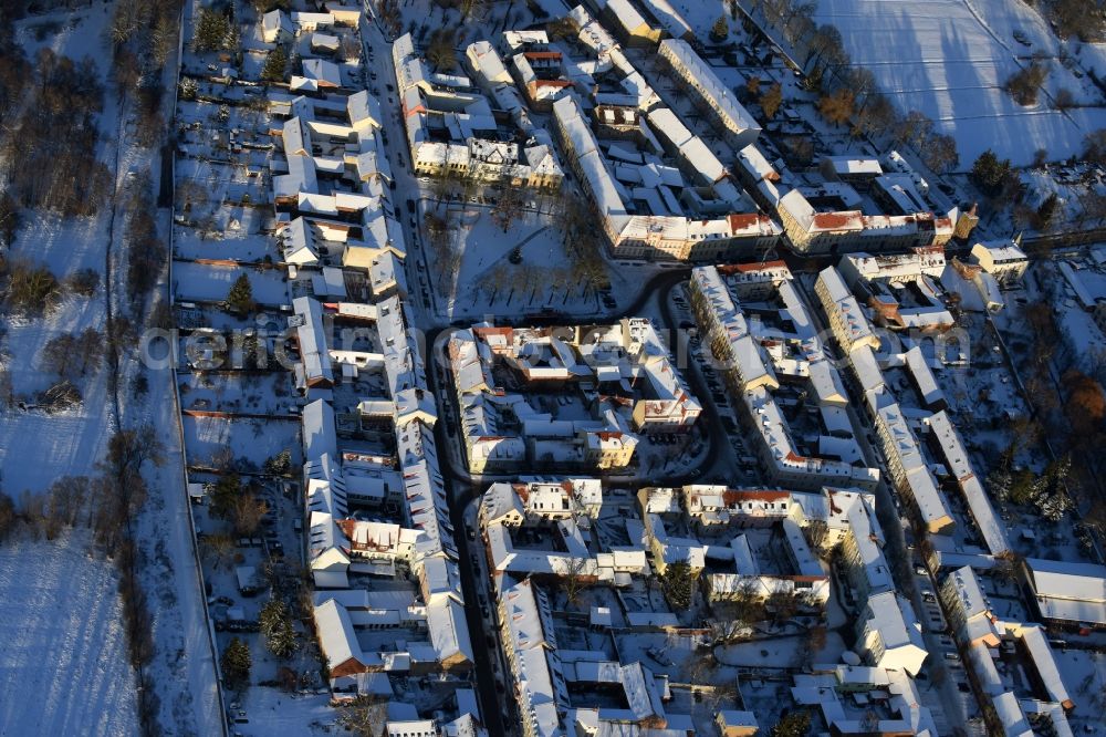 Aerial photograph Altlandsberg - Wintry snowy Town View of the streets and houses of the residential areas in Altlandsberg in the state Brandenburg