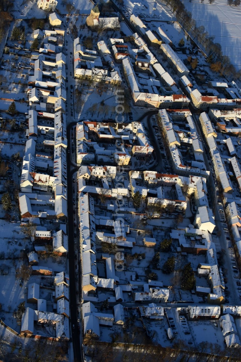 Altlandsberg from above - Wintry snowy Town View of the streets and houses of the residential areas in Altlandsberg in the state Brandenburg