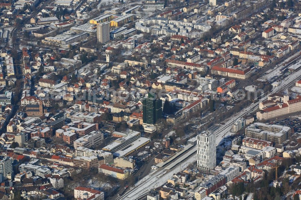 Lörrach from the bird's eye view: Wintry snowy townscape with streets and houses of the residential areas in Loerrach in the state Baden-Wuerttemberg