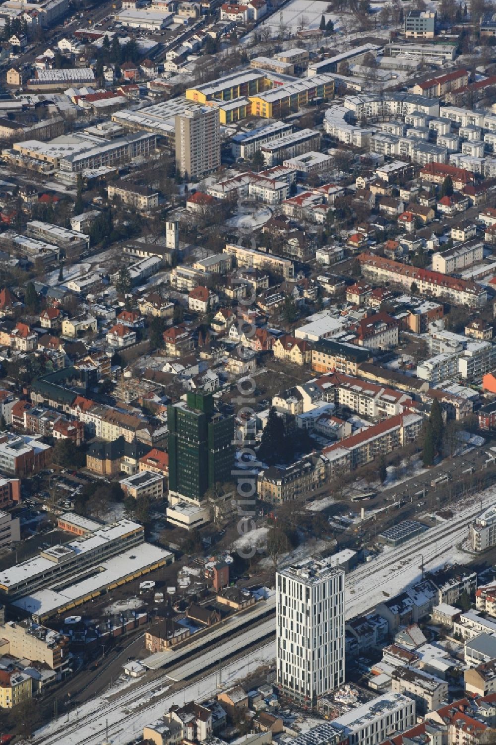 Aerial image Lörrach - Wintry snowy townscape with streets and houses of the residential areas in Loerrach in the state Baden-Wuerttemberg