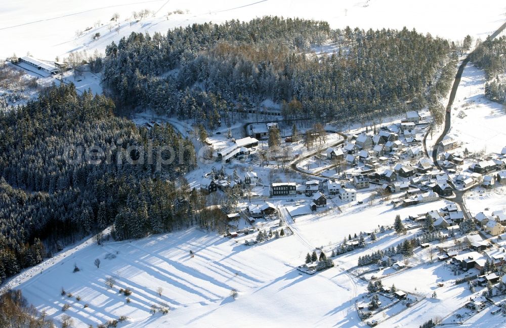 Aerial image Oberweißbach/Thüringer Wald - Wintry snowy townscape with streets and houses of the residential areas in Oberweissbach/Thueringer Wald in the state Thuringia