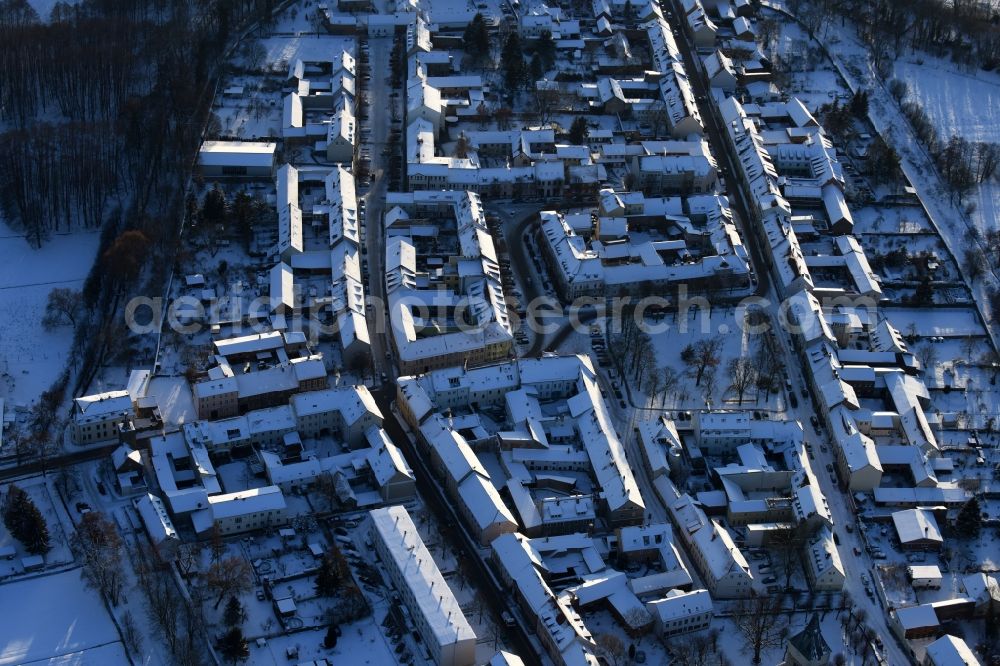 Aerial image Altlandsberg - Wintry snowy Town View of the streets and houses of the residential areas in the district Altlandsberg in Altlandsberg in the state Brandenburg