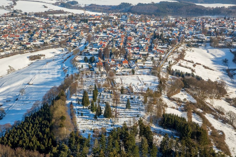 Aerial image Rüthen - Wintry snowy townscape with streets and houses of the residential areas in Ruethen in the state North Rhine-Westphalia