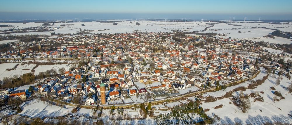 Aerial image Rüthen - Wintry snowy townscape with streets and houses of the residential areas in Ruethen in the state North Rhine-Westphalia