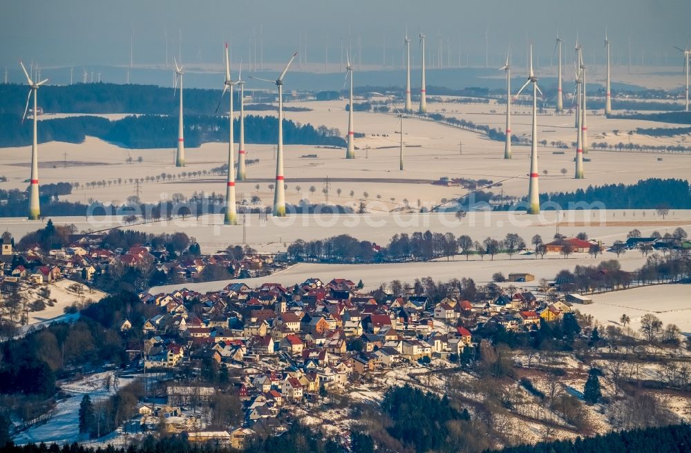 Rüthen from the bird's eye view: Wintry snowy townscape with streets and houses of the residential areas in Ruethen in the state North Rhine-Westphalia