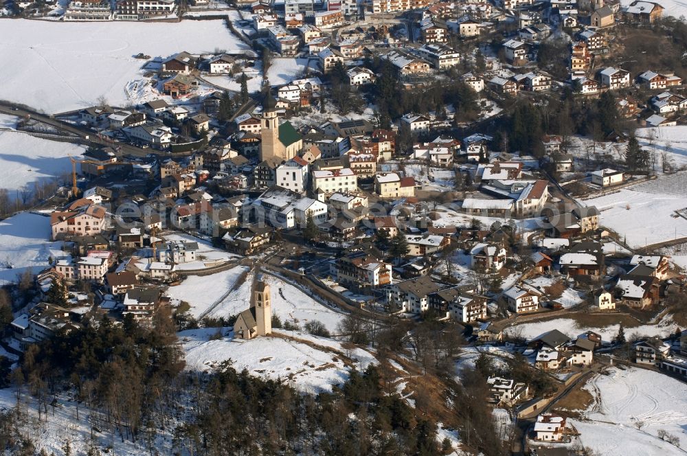 Aerial photograph Völs am Schlern - Fié allo Sciliar - Wintry snowy townscape with streets and houses of the residential areas in Voels am Schlern - Fie allo Sciliar in Trentino-Alto Adige, Italy