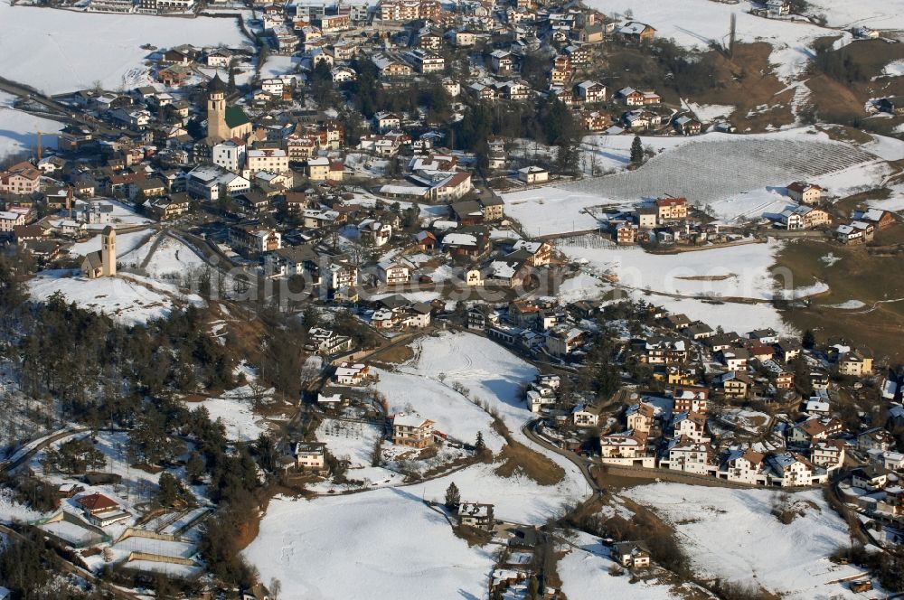 Völs am Schlern - Fié allo Sciliar from above - Wintry snowy townscape with streets and houses of the residential areas in Voels am Schlern - Fie allo Sciliar in Trentino-Alto Adige, Italy