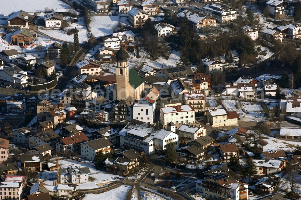 Völs am Schlern - Fié allo Sciliar from above - Wintry snowy townscape with streets and houses of the residential areas in Voels am Schlern - Fie allo Sciliar in Trentino-Alto Adige, Italy