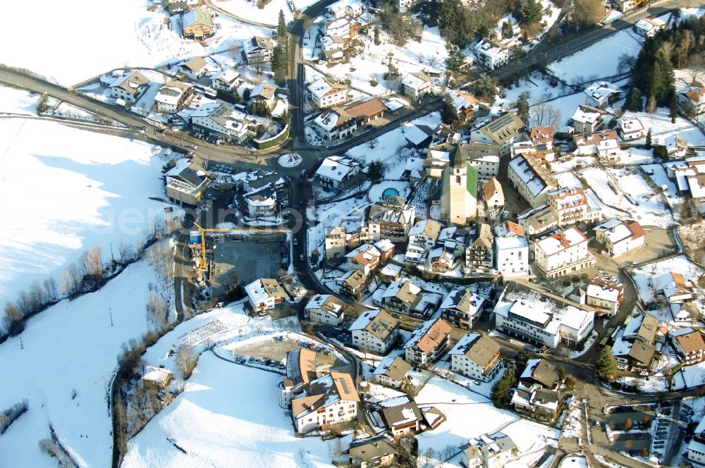 Aerial image Völs am Schlern - Fié allo Sciliar - Wintry snowy townscape with streets and houses of the residential areas in Voels am Schlern - Fie allo Sciliar in Trentino-Alto Adige, Italy