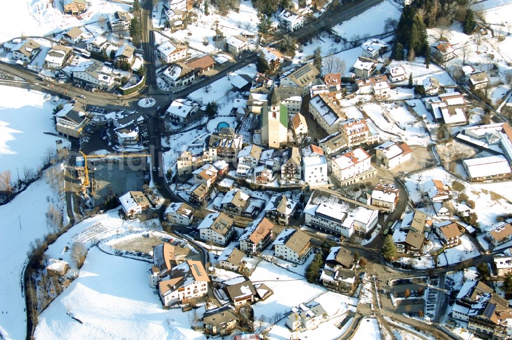 Aerial photograph Völs am Schlern - Fié allo Sciliar - Wintry snowy townscape with streets and houses of the residential areas in Voels am Schlern - Fie allo Sciliar in Trentino-Alto Adige, Italy