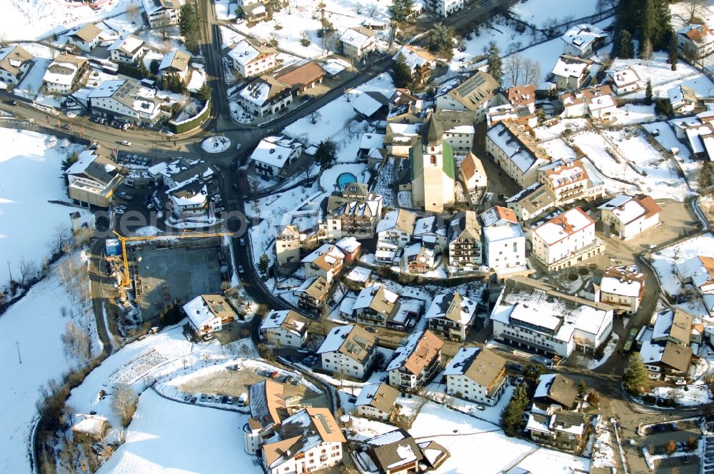 Völs am Schlern - Fié allo Sciliar from above - Wintry snowy townscape with streets and houses of the residential areas in Voels am Schlern - Fie allo Sciliar in Trentino-Alto Adige, Italy