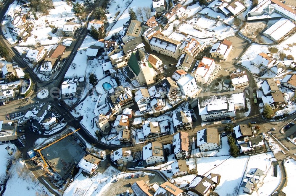 Völs am Schlern - Fié allo Sciliar from above - Wintry snowy townscape with streets and houses of the residential areas in Voels am Schlern - Fie allo Sciliar in Trentino-Alto Adige, Italy