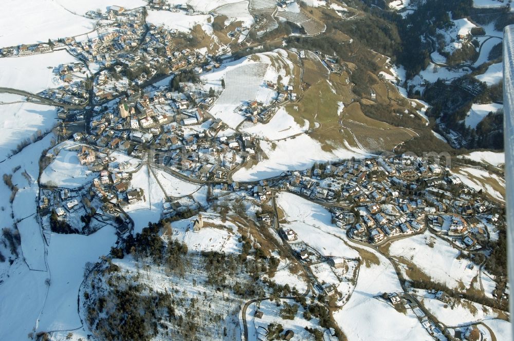 Völs am Schlern - Fié allo Sciliar from above - Wintry snowy townscape with streets and houses of the residential areas in Voels am Schlern - Fie allo Sciliar in Trentino-Alto Adige, Italy