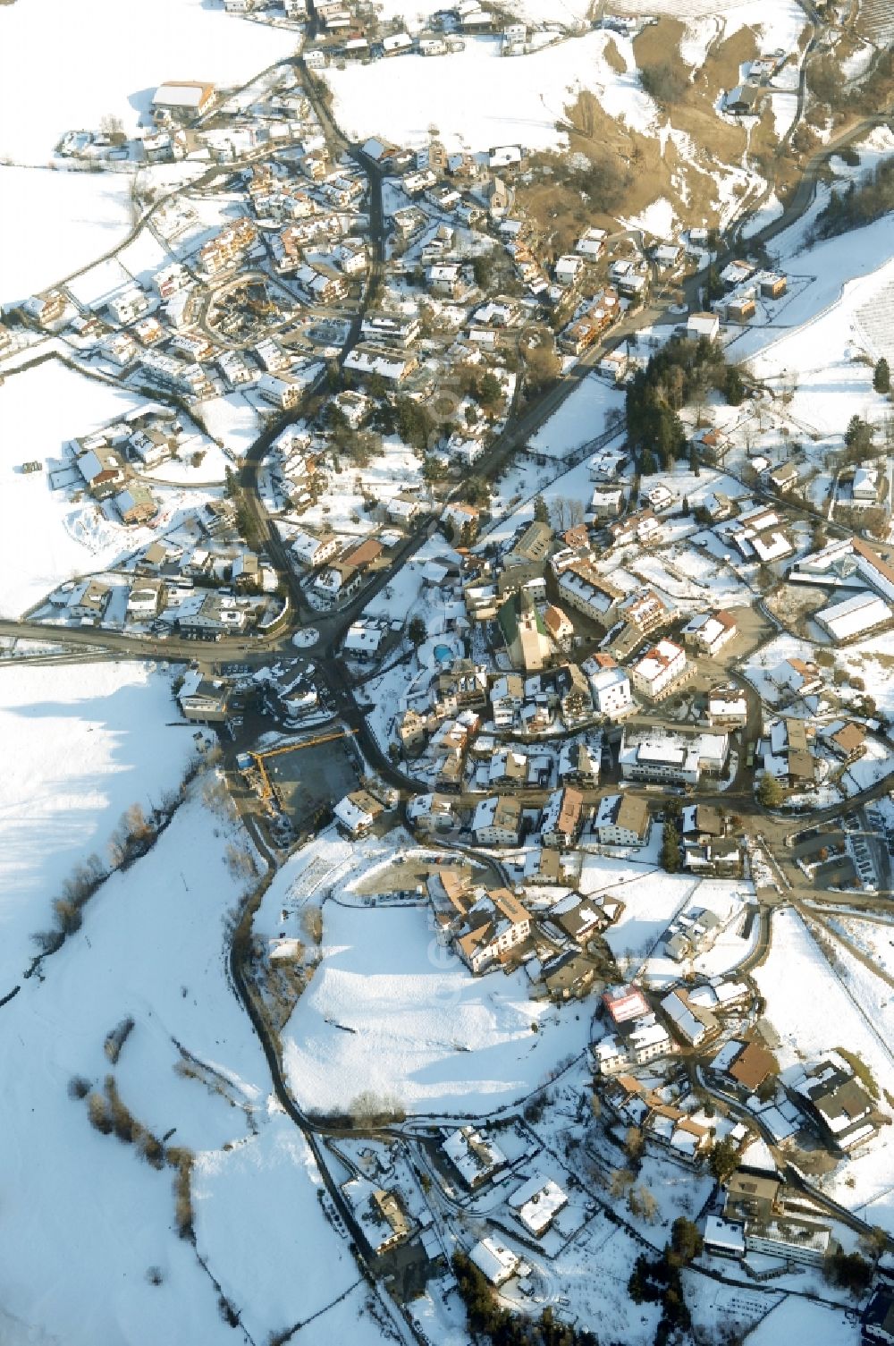 Völs am Schlern - Fié allo Sciliar from above - Wintry snowy townscape with streets and houses of the residential areas in Voels am Schlern - Fie allo Sciliar in Trentino-Alto Adige, Italy