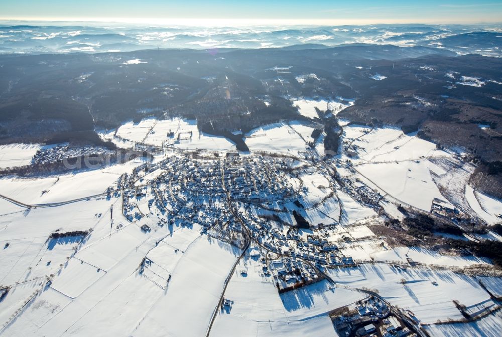 Warstein from above - Wintry snowy townscape with streets and houses of the residential areas in Warstein in the state North Rhine-Westphalia