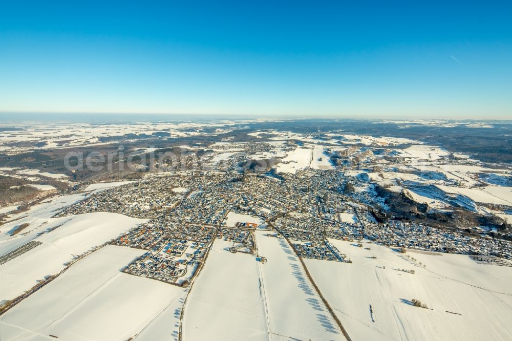 Warstein from above - Wintry snowy townscape with streets and houses of the residential areas in Warstein in the state North Rhine-Westphalia