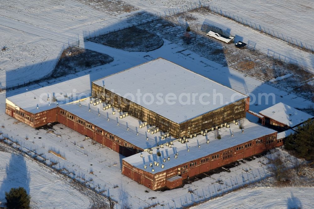 Aerial image Brandenburg an der Havel - Winterly snowy ruins of the former airfield hangar of the former airfield Brandenburg-Briest in Brandenburg an der Havel in the state Brandenburg