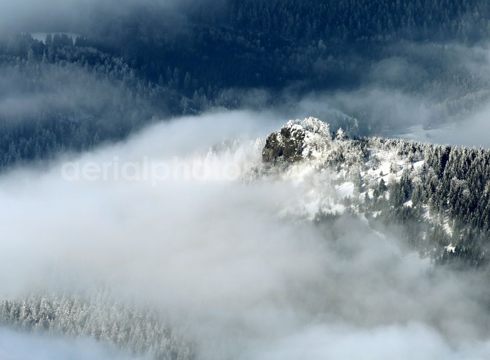 Aerial image Oberhof - Winter snow covered forest landscape with rock formation Saukopf in Oberhof in Thuringia