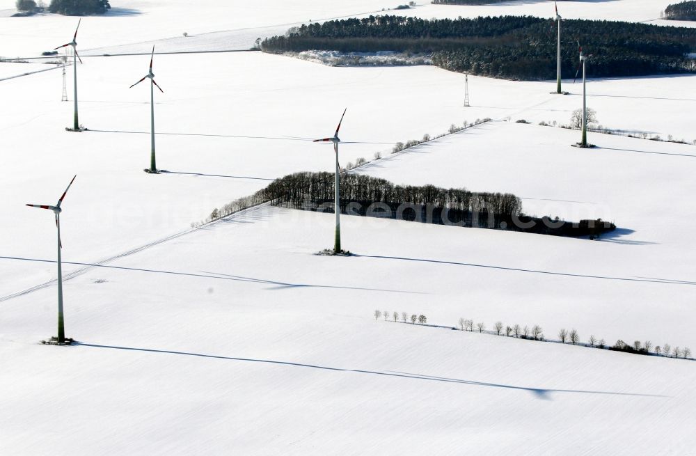 Bösleben-Wüllersleben from above - Wintry snowy wind turbine windmills on a field in Boesleben-Wuellersleben in the state Thuringia