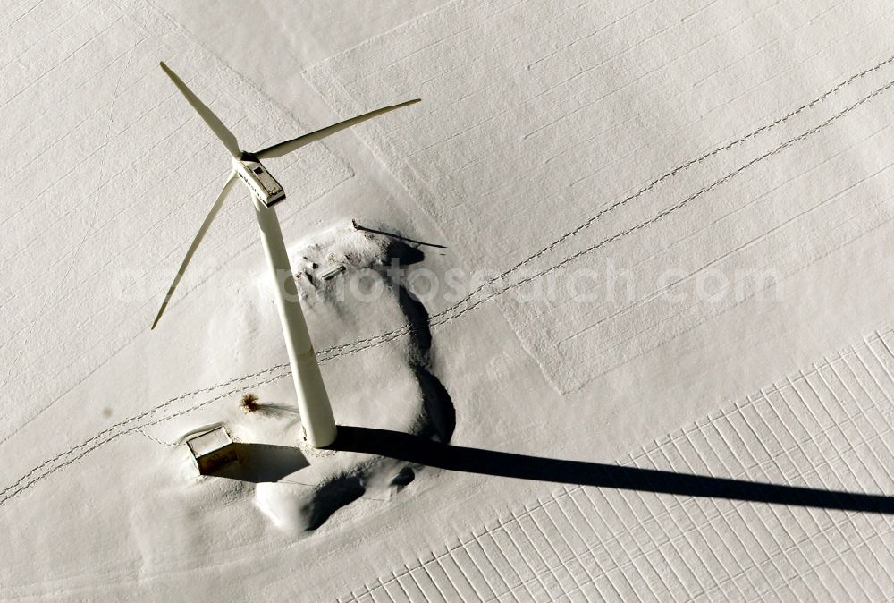 Bösleben-Wüllersleben from the bird's eye view: Wintry snowy wind turbine windmills on a field in Boesleben-Wuellersleben in the state Thuringia