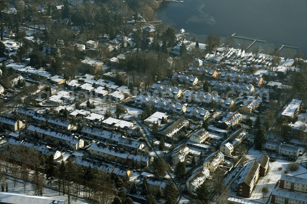 Berlin from above - Snow-covered residential area on the shores of the river Havel in the district of Spandau in Berlin in Germany