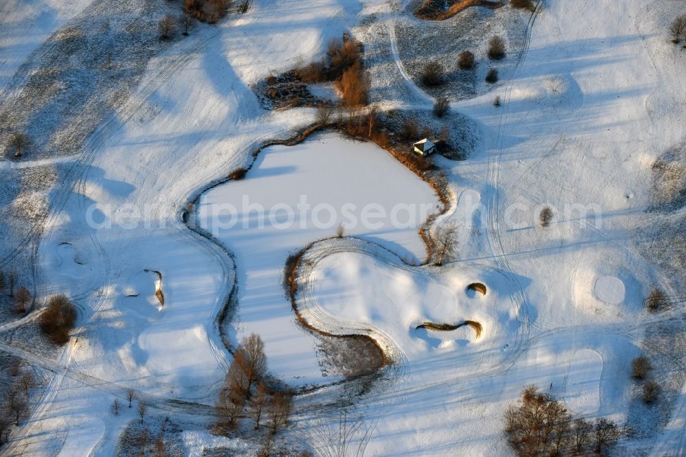 Aerial image Hohen Neuendorf - Wintry snowy grounds of the Golf course at Berliner Golfclub Stolperheide e.V. in Hohen Neuendorf in the state Brandenburg