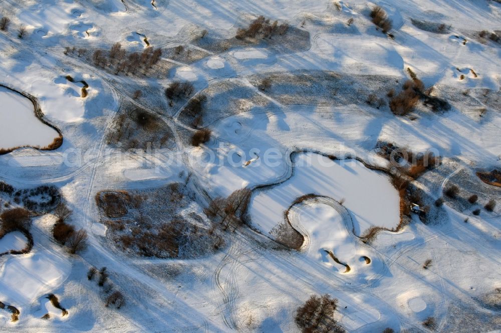 Hohen Neuendorf from above - Wintry snowy grounds of the Golf course at Berliner Golfclub Stolperheide e.V. in Hohen Neuendorf in the state Brandenburg