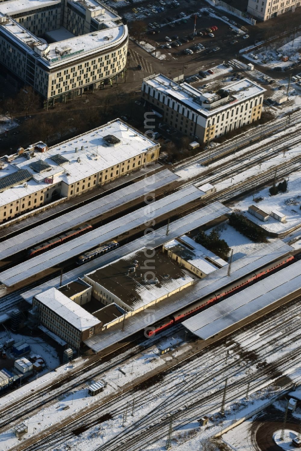 Magdeburg from above - Winterly snowy track progress and building of the main station of the railway in Magdeburg in the state Saxony-Anhalt