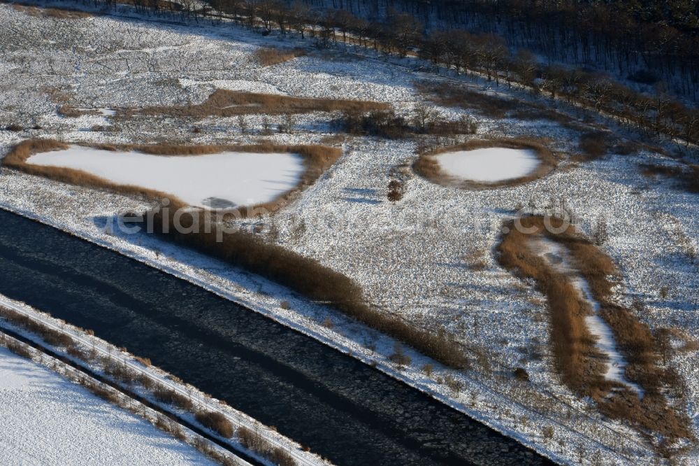 Aerial image Burg - Wintry snowy channel course and riparian areas on renatured Altarm the Elbe-Havel Canal near Burg in Saxony-Anhalt