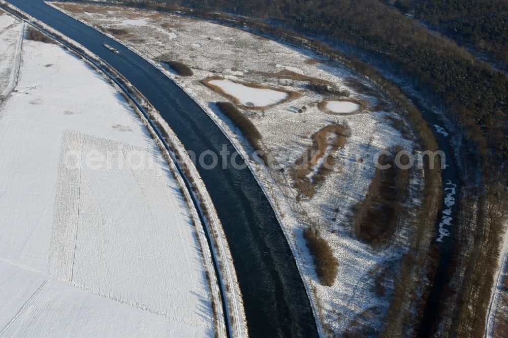 Burg from above - Wintry snowy channel course and riparian areas on renatured Altarm the Elbe-Havel Canal near Burg in Saxony-Anhalt