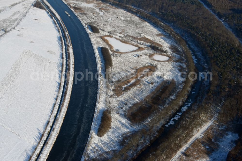 Aerial image Burg - Wintry snowy channel course and riparian areas on renatured Altarm the Elbe-Havel Canal near Burg in Saxony-Anhalt