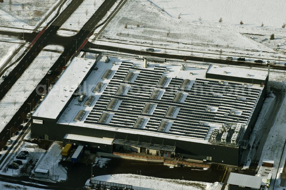 Berlin from above - Wintry snowy warehouse complex-building in the industrial area on Gross-Berliner Damm in Berlin in Germany