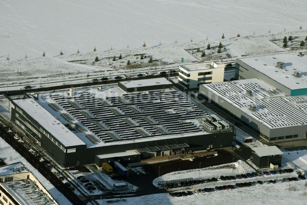 Berlin from the bird's eye view: Wintry snowy warehouse complex-building in the industrial area on Gross-Berliner Damm in Berlin in Germany