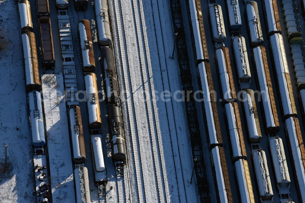 Brandenburg an der Havel from the bird's eye view: Wintry snowy marshalling yard and freight station of the Deutsche Bahn in Brandenburg an der Havel in the state Brandenburg