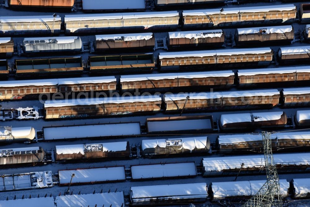 Brandenburg an der Havel from above - Wintry snowy marshalling yard and freight station of the Deutsche Bahn in Brandenburg an der Havel in the state Brandenburg