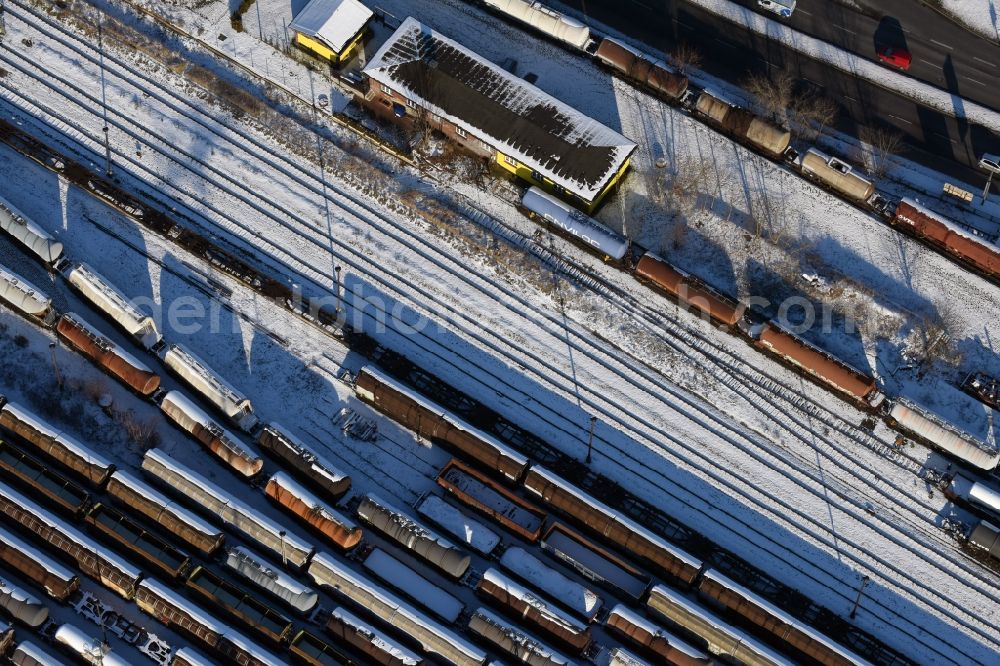 Aerial photograph Brandenburg an der Havel - Wintry snowy marshalling yard and freight station of the Deutsche Bahn in Brandenburg an der Havel in the state Brandenburg