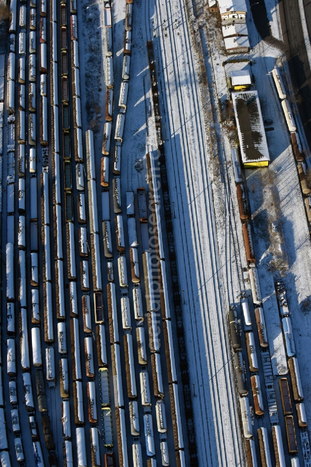 Brandenburg an der Havel from the bird's eye view: Wintry snowy marshalling yard and freight station of the Deutsche Bahn in Brandenburg an der Havel in the state Brandenburg